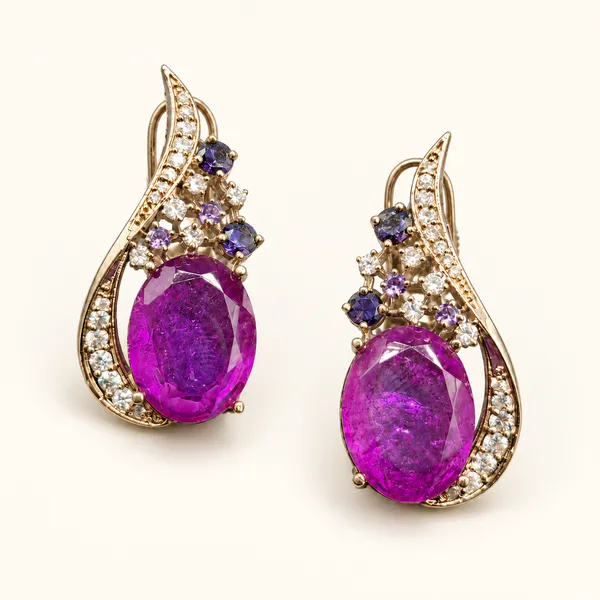 Curved_earrings_with_oval_purple_drops_and_small_stone_accents_|_Purple_/_clear_/_gold_tone