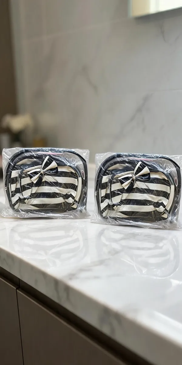 Flagged:_Multicolor_Plastic_Striped_Cosmetic_Pouch_3_In_1_For_Women_[Review:_Material_Conflict_(Fabric_Vs_Plastic/Resin),_Color_Conflict_(Black-White_Vs_Multicolor),_Product_Type_Conflict_(Handbag_Vs_Cosmetic_Pouch)]_-_Pack_of_2