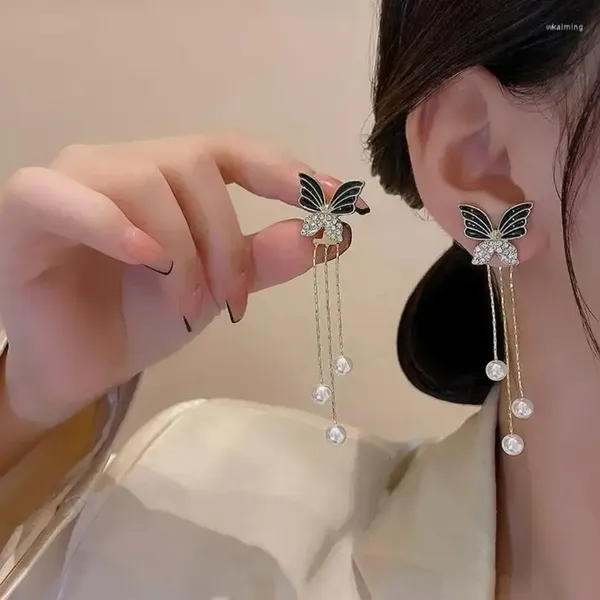 Premium_Butterfly_Earrings_Combo_–_Black_Pearl,_Ivory_Bow_&_Purple_Crystal_Butterfly_Drop_Earrings_|_3_Pair_Combo