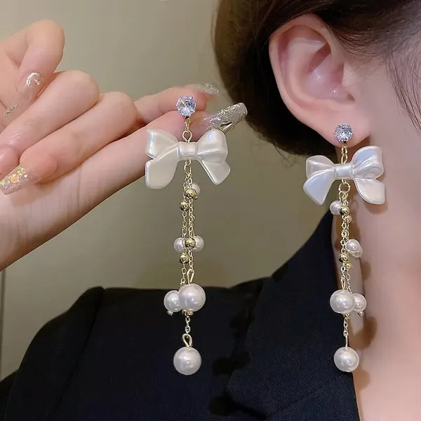 Premium_Butterfly_Earrings_Combo_–_Black_Pearl,_Ivory_Bow_&_Purple_Crystal_Butterfly_Drop_Earrings_|_3_Pair_Combo