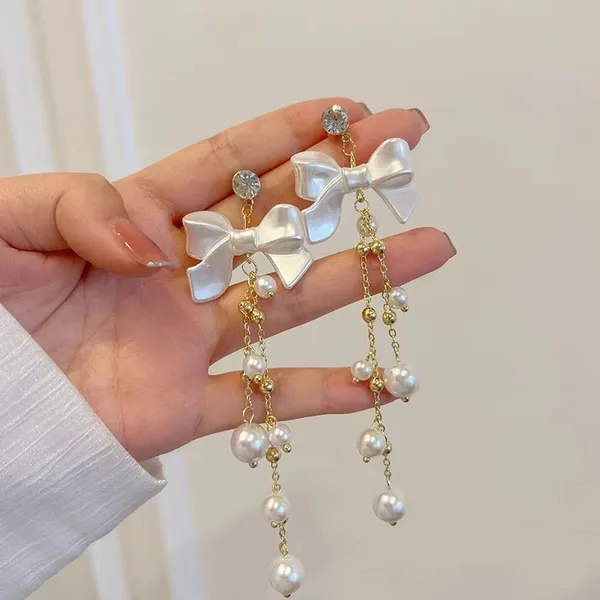 Premium_Butterfly_Earrings_Combo_–_Black_Pearl,_Ivory_Bow_&_Purple_Crystal_Butterfly_Drop_Earrings_|_3_Pair_Combo