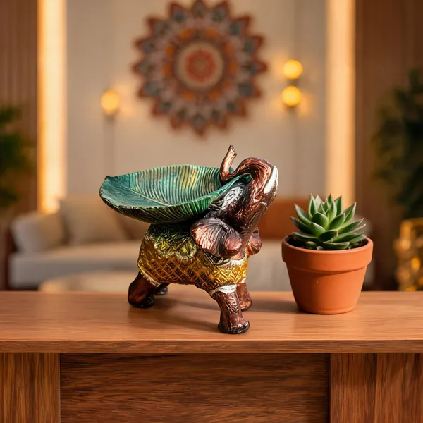 Resin_Brown_Lucky_Elephant_Idol_With_Green_Leaf_Urli_Showpiece