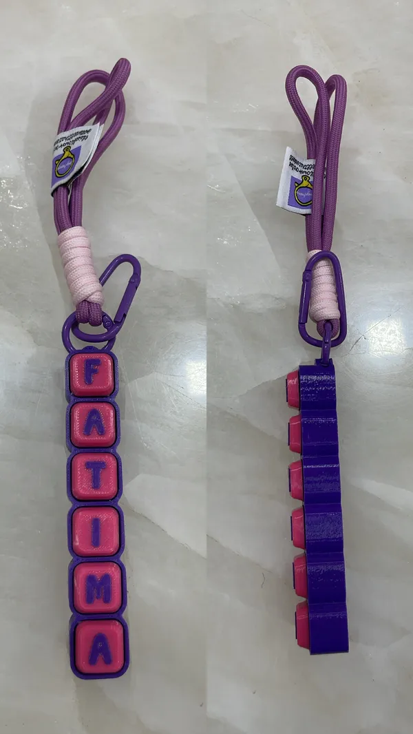 KEY_CHAIN_FIDGET_CLICKER_PURPLE_BASE_WITH_PINK_CAPS_CUSTOM_NAME