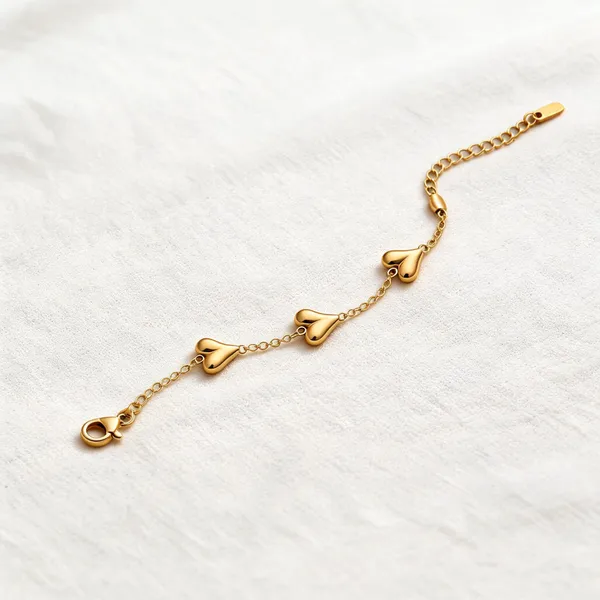 Golden_Alloy_Triple_Heart_Charm_Bracelet_For_Women