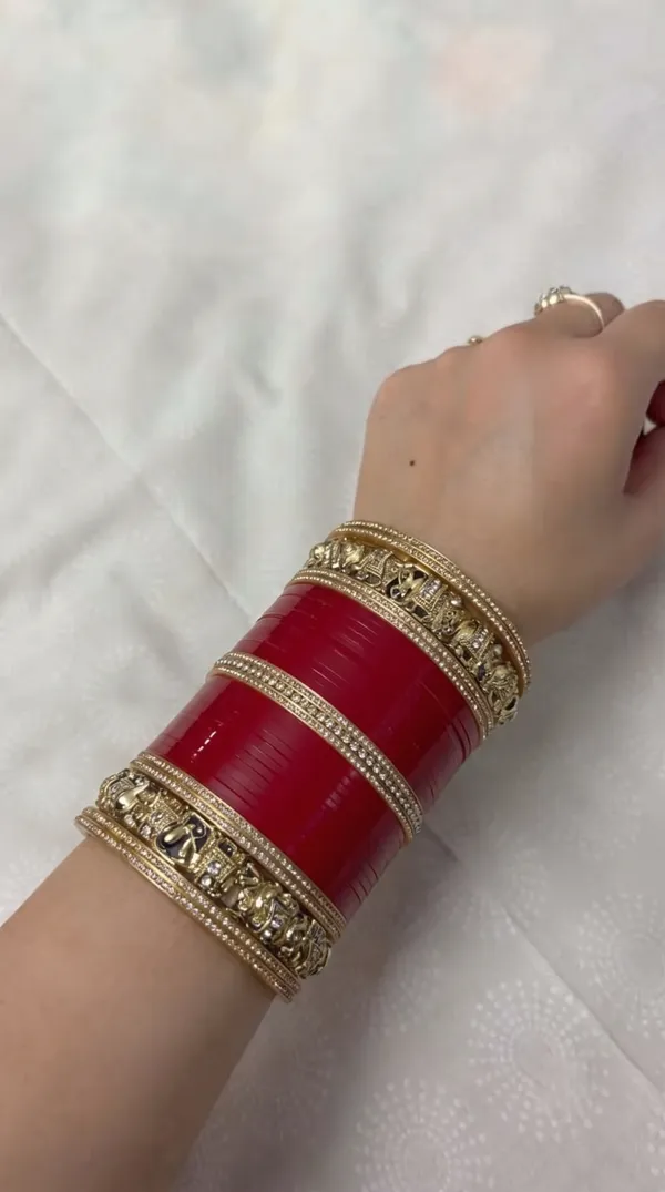 Maroon_Plastic_Gold_Tone_Embellished_Chura_Set_For_Women