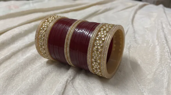 Maroon_Plastic_Gold-Tone_Pearl_Embellished_Chura_Set_For_Women