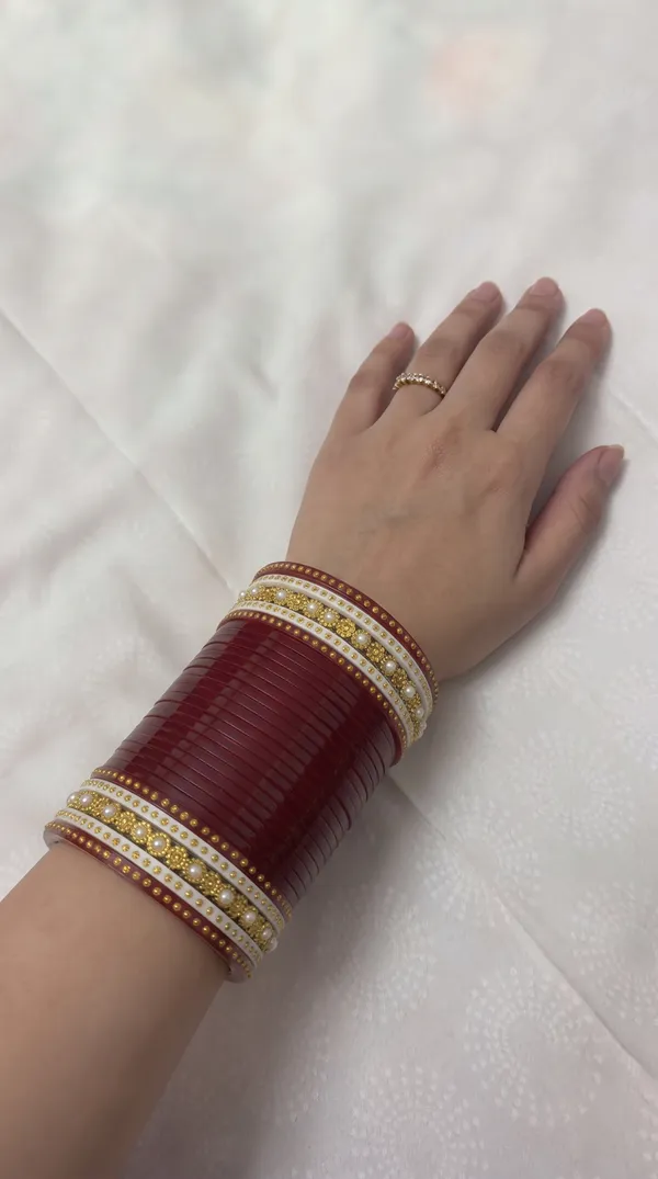 Maroon_Plastic_Gold-Tone_Layered_Embellished_Chura_Set_For_Women
