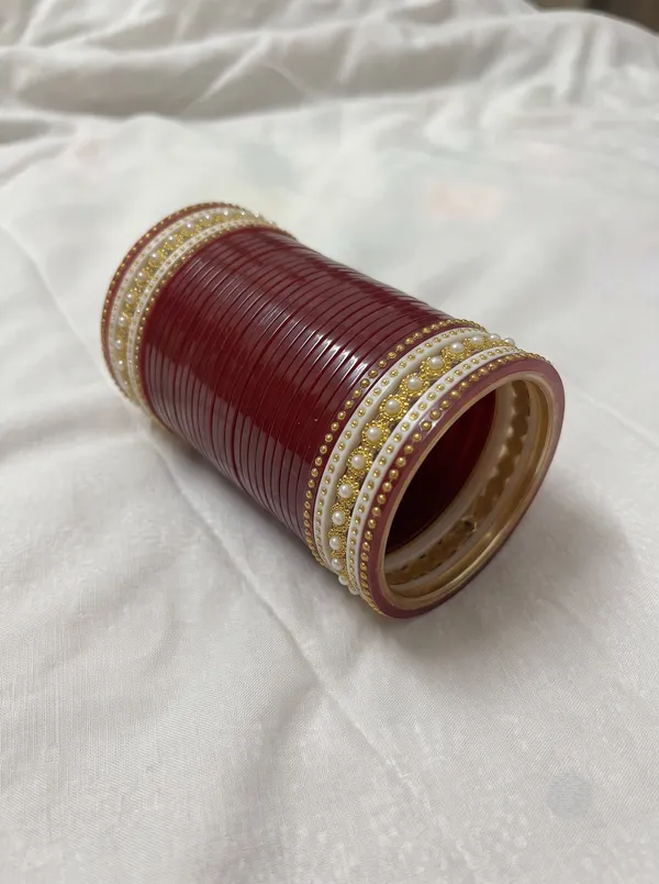 Maroon_Plastic_Floral_Gold-Tone_Embellished_Chura_Set_For_Women