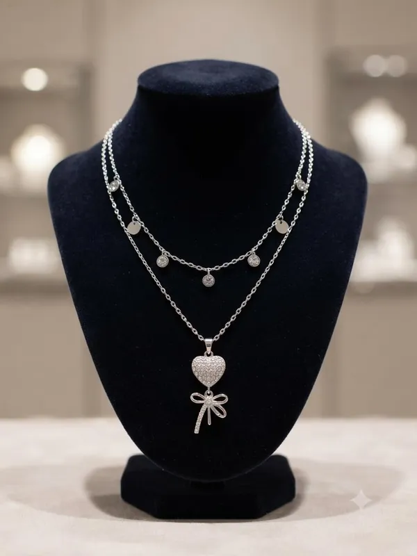 Layered_Necklace_With_Heart_And_Bow_Pendant