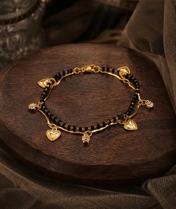 Black_Bead_Mangalsutra_Bracelet_with_Gold_Charms_(Heart_Charm_Mangalsutra_Bracelet_Set)