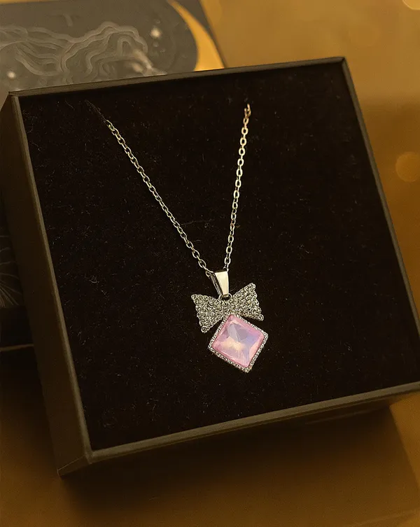 SHANKHRAJ_MALL_Crystal_Bow_Pendant_Necklace_with_Pink_Opal_Square_Stone,_Chrome_Chain,_Rhinestone_Accents_(CN9)