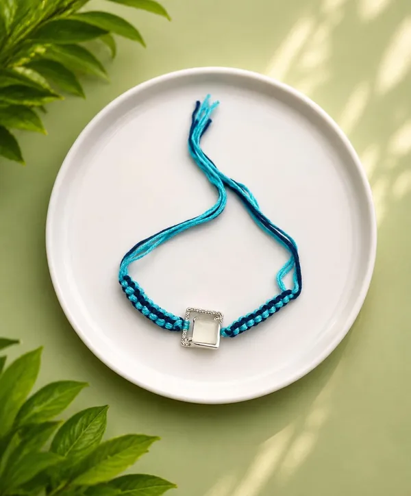 Blue_Designer_Rakhi_for_Brother_with_Braided_Thread_and_Decorative_Centre_Charm,_4,_A630