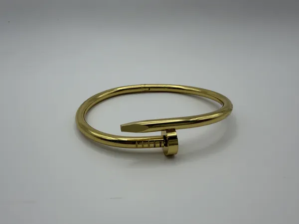 Gold_Alloy_Open_Cuff_Nail_Bracelet_For_Women