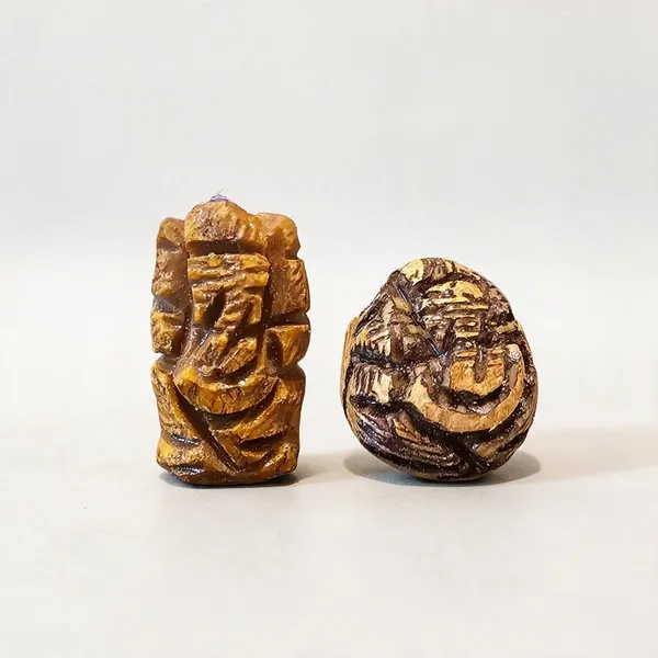 Ganesha_Figurine_Duo_Turmeric_&_Arecanut_Carved_Set