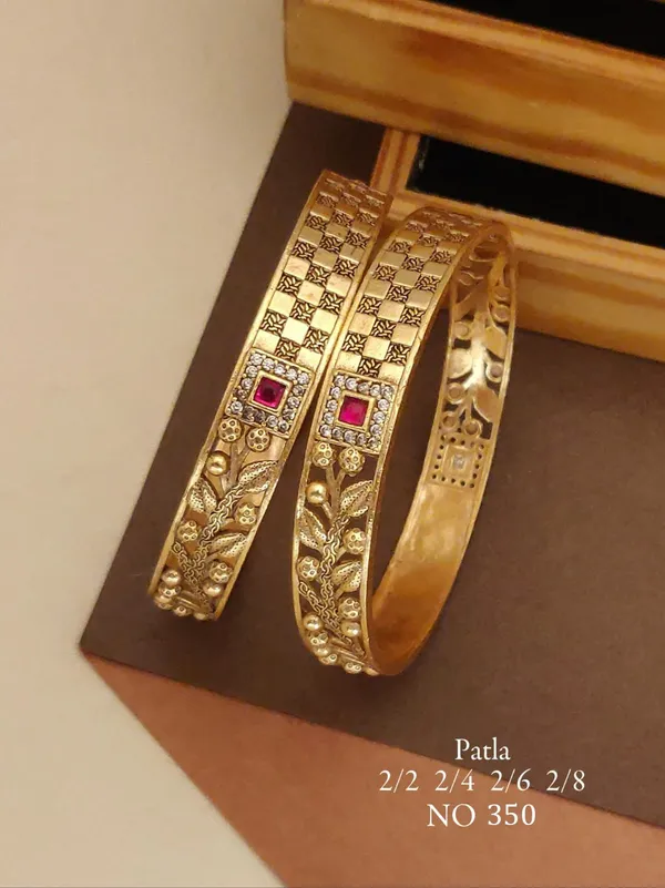 Gold_Tone_Embellished_Patla_Bangles_With_Red_Stones