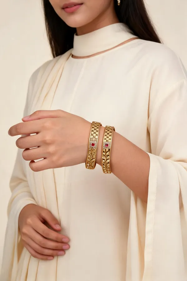 Gold_Tone_Embellished_Patla_Bangles_With_Red_Stones_Set_Of_2