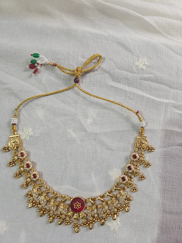 Gold_Tone_Temple_Necklace_Set_With_Maroon_Stones_And_Earrings