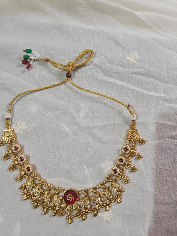 Gold_Tone_Temple_Necklace_Set_With_Maroon_Stones_And_Earrings