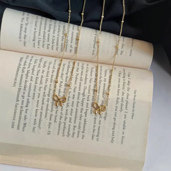 Gold_Stainless_Steel_Bow_Pendant_Necklace_For_Women
