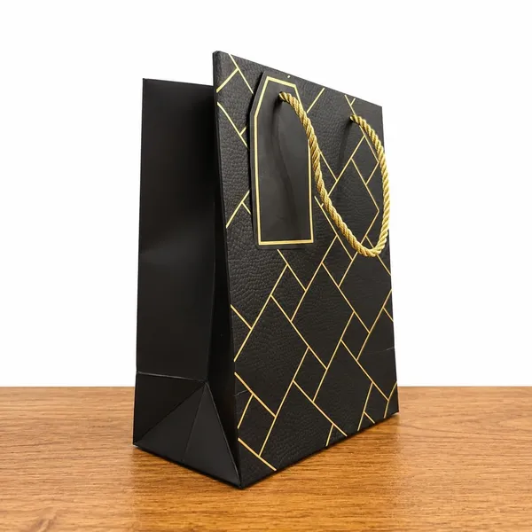 Izels_Premium_Luxury_Paper_Gift_Bags_Pack_Of_5_Leather_Finish_With_Gold_Foil_Geometric_Design_Thick_220_Gsm_Paper_Rope_Handles_Thank_You_Tag_Small_18x10x23_Cms_Black
