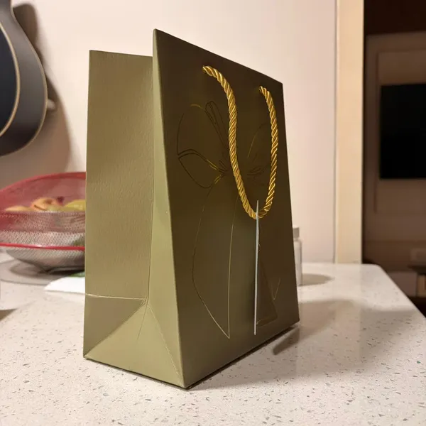 Izels_Metallic_Gift_Bag_With_Gold_Foiling_Bow_23x18x10_Cm_Pista_Green_10_Pieces