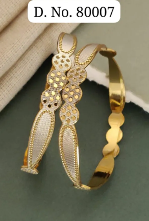 Gold_Alloy_Oval_Motif_Embellished_Bangle_Set_For_Women