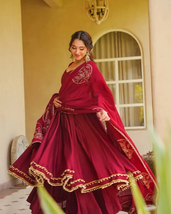 Maroon_Roman_Silk_Flared_Anarkali_Suit_With_Potli_Latkan