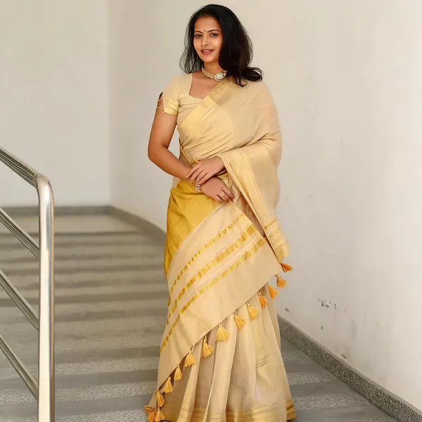 Women's_Off_White_Kerala_Kasavu_Tissue_Silk_Saree_with_Golden_Zari_Border_&_Tassel_Pallu_|_Traditional_Onam,_Vishu_&_Wedding_Wear_Saree