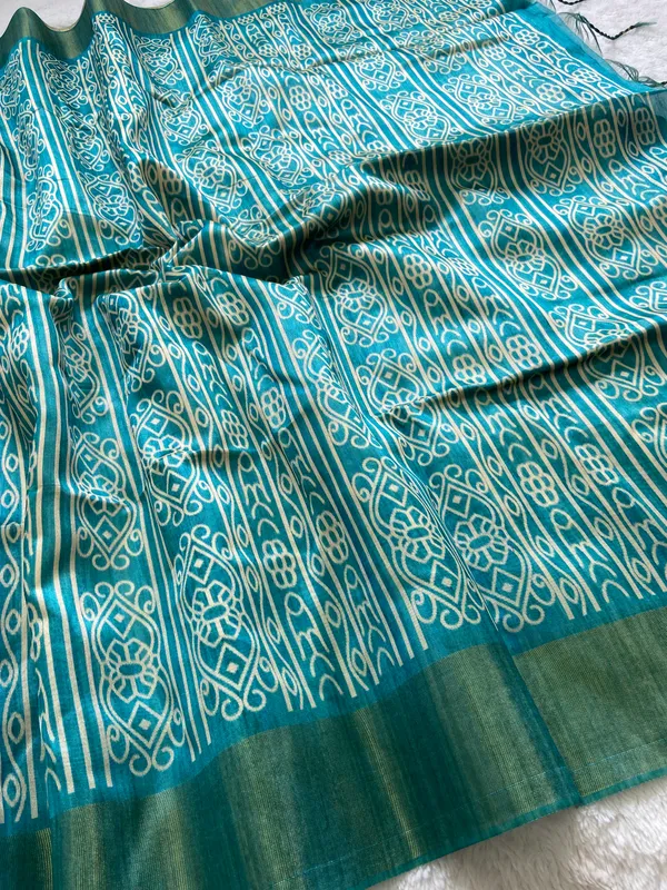 Soft_Tussar_Silk_sarees_with_Beautiful_Print_With_Attractive_Border_And_Contrast_Print_Blouse_With_Tassels