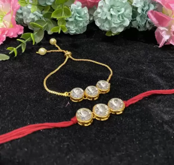 https://d1311wbk6unapo.cloudfront.net/NushopCatalogue/tr:f-webp,w-600,fo-auto/DHIVARA_DESIGNER_BHAIYA_BHABHI_RAKHI_WITH_ROLI_CHAWAL__AKN7IX3SXS_2024-07-13_1.JPg__DHIVARA