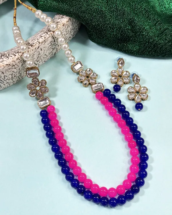 https://d1311wbk6unapo.cloudfront.net/NushopCatalogue/tr:f-webp,w-600,fo-auto/Dhivara_Two_Layer_Pink_and_Blue_Pearl_and_Alloy_Jewellery_set_for_Women_O7K31D3JDZ_2024-08-01_1.jpeg__DHIVARA