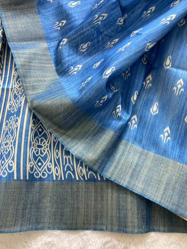 Manjusha_Blue_–_Treasured_Navratri_Special_|_Soft_Tussar_Silk_Saree_with_Print,_Border_&_Contrast_Print_Blouse_with_Tassels