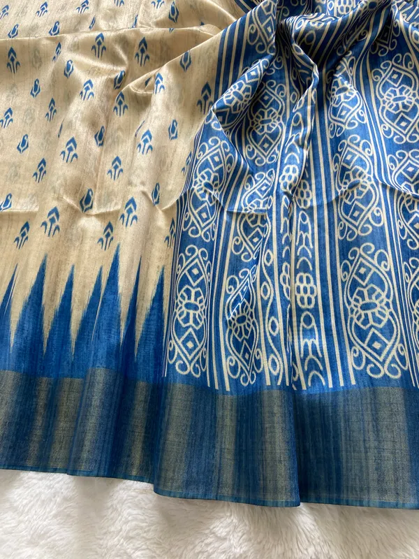 Manjusha_Blue_–_Treasured_Navratri_Special_|_Soft_Tussar_Silk_Saree_with_Print,_Border_&_Contrast_Print_Blouse_with_Tassels