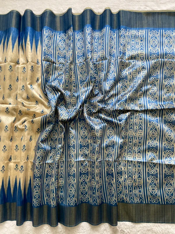 Manjusha_Blue_–_Treasured_Navratri_Special_|_Soft_Tussar_Silk_Saree_with_Print,_Border_&_Contrast_Print_Blouse_with_Tassels