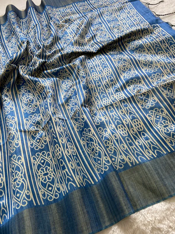 Manjusha_Blue_–_Treasured_Navratri_Special_|_Soft_Tussar_Silk_Saree_with_Print,_Border_&_Contrast_Print_Blouse_with_Tassels