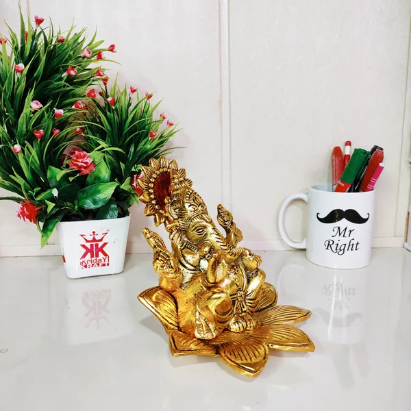 Metal_Ganesh_Sit_On_Flower_Gold_Color_Leaf_For_Pooja