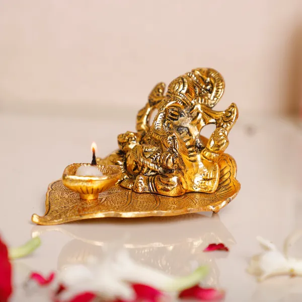 Ganesha_On_Leaf_With_Diya_Metal_Statue