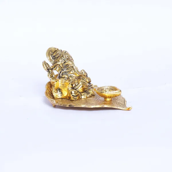 Ganesha_On_Leaf_With_Diya_Metal_Statue