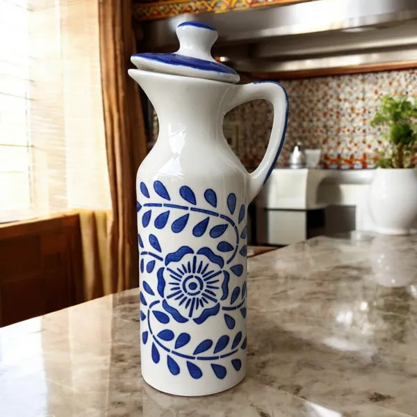 https://d1311wbk6unapo.cloudfront.net/NushopCatalogue/tr:f-webp,w-600,fo-auto/Madarks_Hand_Painted_Ceramic_Oil_Dispenser__300_ml_S0UE0LR83I_2024-08-05_1.png__Madarks