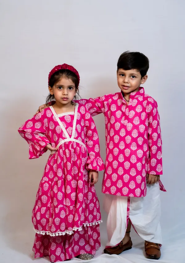 https://d1311wbk6unapo.cloudfront.net/NushopCatalogue/tr:f-webp,w-600,fo-auto/Modish_ethnic_wear_for_brother_and_sister_combo_in_matching_pink_color_KOL3624MVI_2024-07-24_1.jpg__ modish