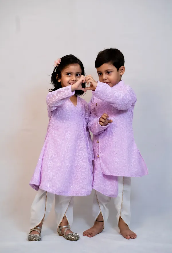 https://d1311wbk6unapo.cloudfront.net/NushopCatalogue/tr:f-webp,w-600,fo-auto/Modish_ethnic_wear_for_brother_and_sister_combo_in_matching_purple_color_WWVTHEMUPJ_2024-07-22_1.jpg__ modish