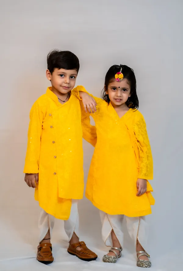 https://d1311wbk6unapo.cloudfront.net/NushopCatalogue/tr:f-webp,w-600,fo-auto/Modish_ethnic_wear_for_brother_and_sister_combo_in_matching_yellow_color_9A0E75E4W5_2024-07-22_1.jpg__ modish