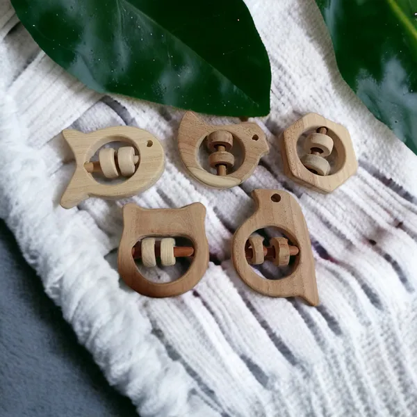 Set_of_5_Satisfying_Sound_Making_Rattles_-Sparrow,_Dove,_Fish,_Hippo_&_Hexagon_Shapes-made_up_of_pure_neem_wood