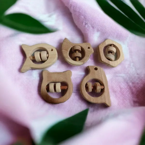 Set_of_5_Satisfying_Sound_Making_Rattles_-Sparrow,_Dove,_Fish,_Hippo_&_Hexagon_Shapes-made_up_of_pure_neem_wood