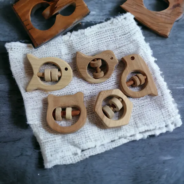 Set_of_5_Satisfying_Sound_Making_Rattles_-Sparrow,_Dove,_Fish,_Hippo_&_Hexagon_Shapes-made_up_of_pure_neem_wood