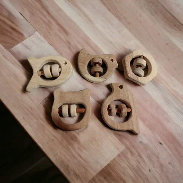 Set_of_5_Satisfying_Sound_Making_Rattles_-Sparrow,_Dove,_Fish,_Hippo_&_Hexagon_Shapes-made_up_of_pure_neem_wood