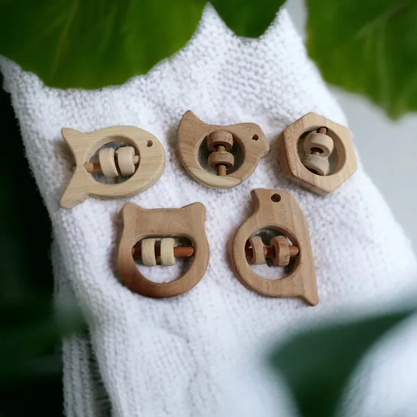 Set_of_5_Satisfying_Sound_Making_Rattles_-Sparrow,_Dove,_Fish,_Hippo_&_Hexagon_Shapes-made_up_of_pure_neem_wood