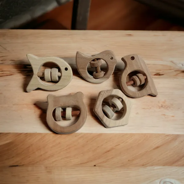 Set_of_5_Satisfying_Sound_Making_Rattles_-Sparrow,_Dove,_Fish,_Hippo_&_Hexagon_Shapes-made_up_of_pure_neem_wood