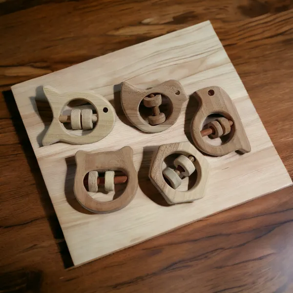 Set_of_5_Satisfying_Sound_Making_Rattles_-Sparrow,_Dove,_Fish,_Hippo_&_Hexagon_Shapes-made_up_of_pure_neem_wood