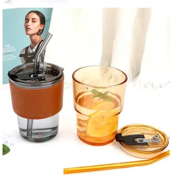 Glass_Tumbler_with_Silicone_Straw_and_Lid_435ml,_Pack_of_2_Glass_Cup_with_Leather_Sleeve,_Glass_Coffee_Mugs_for_Straw_and_Direct_Drinking_Mouth_Dual_Use,_Summer_Travel_Essential_Bottle_(Amber_+_Black)